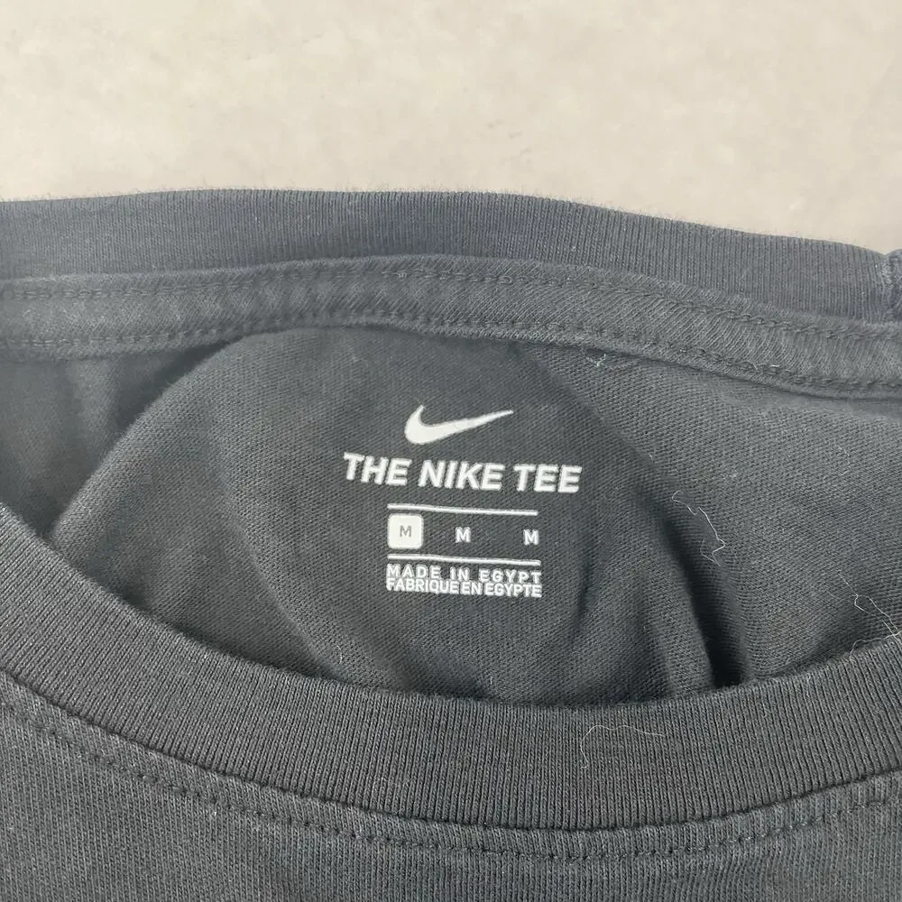 Nike Black long-sleeve t-shirt featuring metallic gold script logos Size Medium
